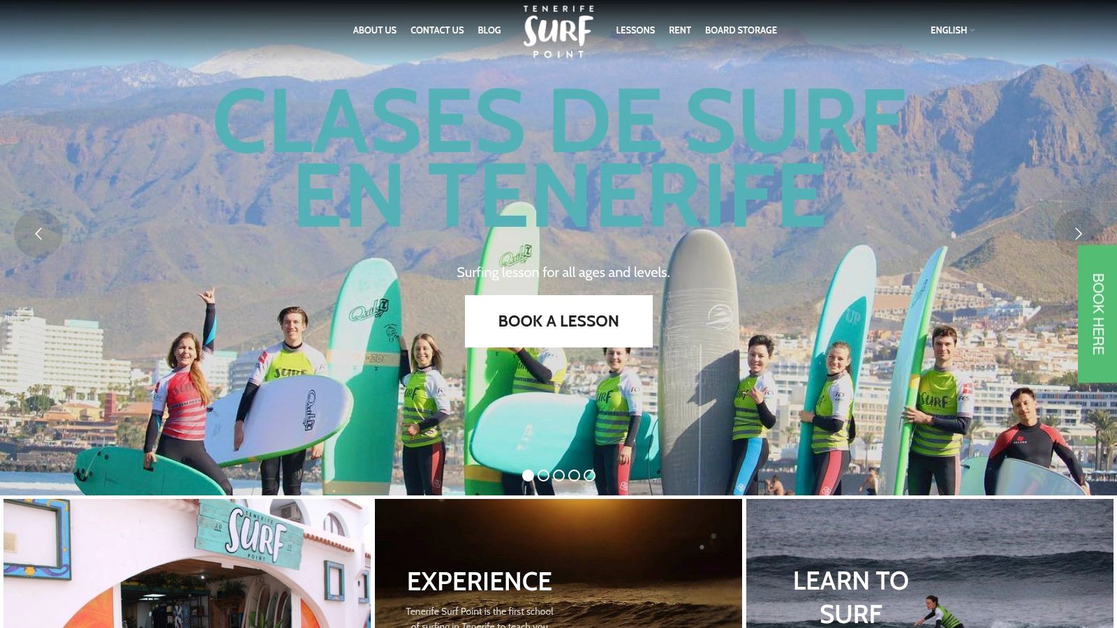 A group of surfers receiving instructions on the beach from Tenerife Surf Point