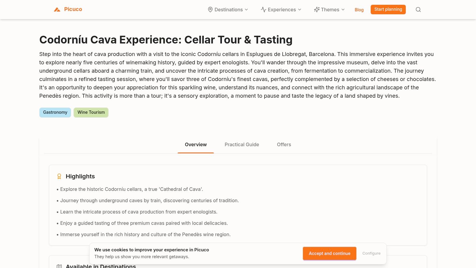 A group of people enjoying a wine tasting session in the historic Codorníu cellars.