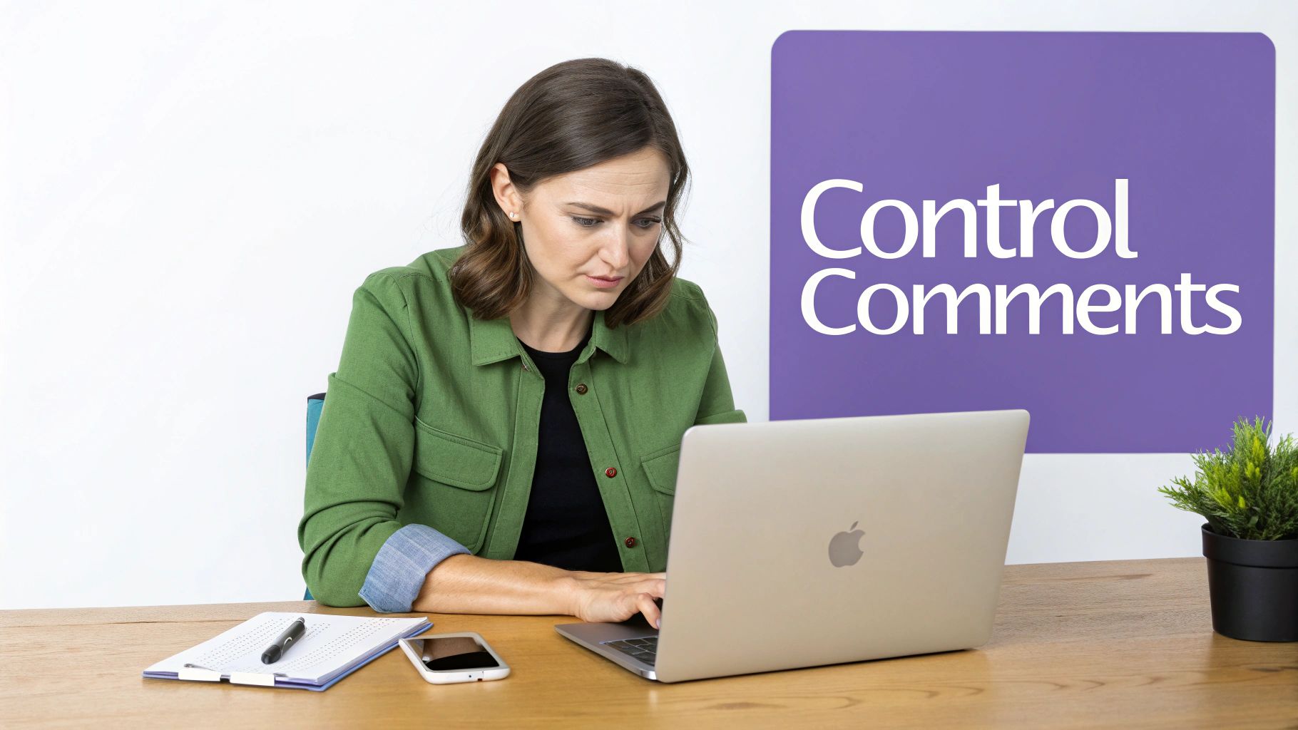 A focused woman with short brown hair working intently on a silver laptop at a wooden desk, with a purple sign that reads "Control Comments" in the background.