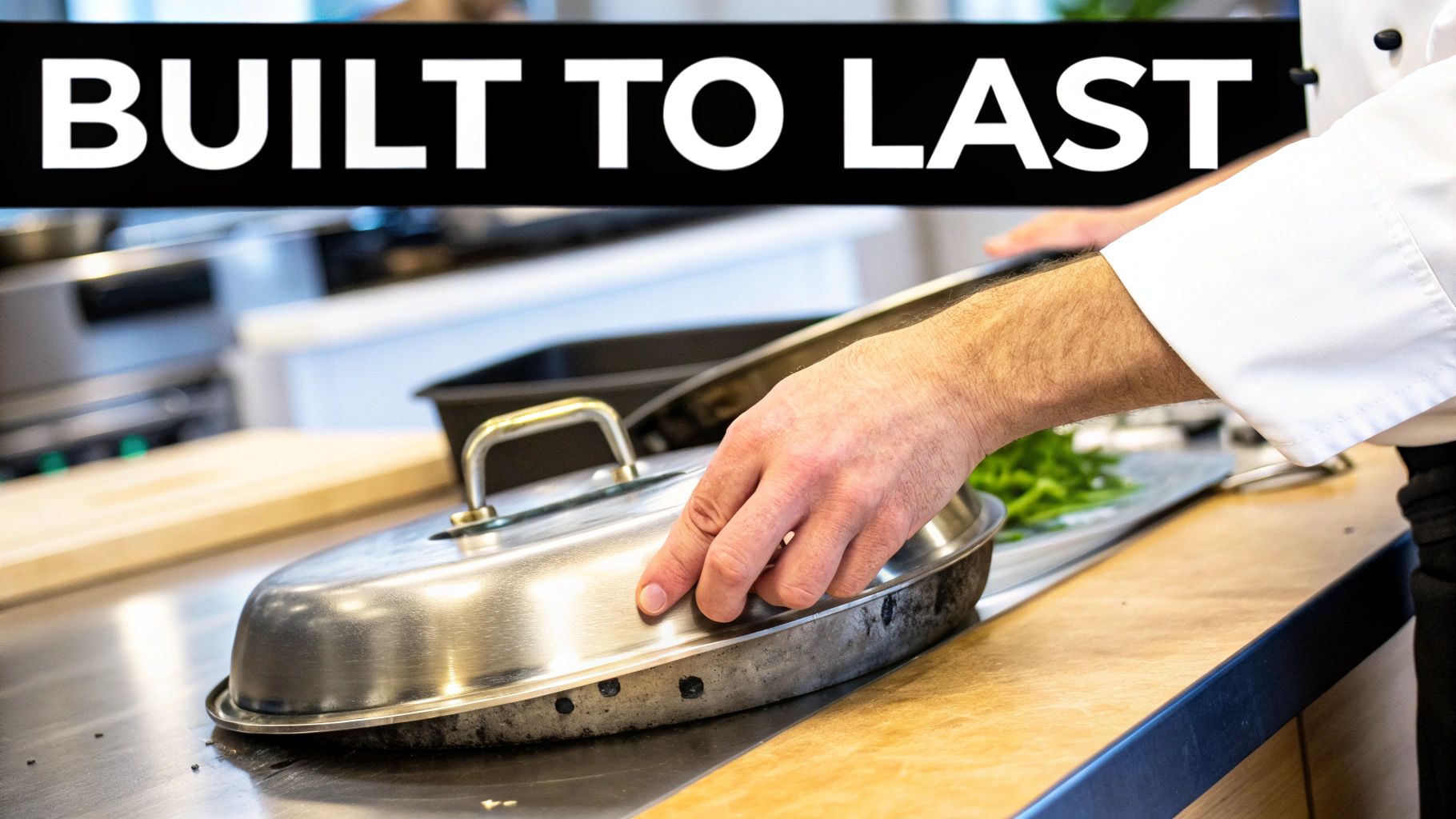 A person inspecting the handle of a stainless steel pan