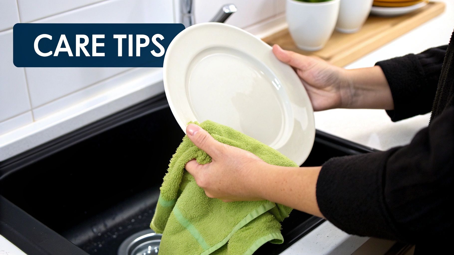 A person carefully washing a ceramic plate by hand in a sink.