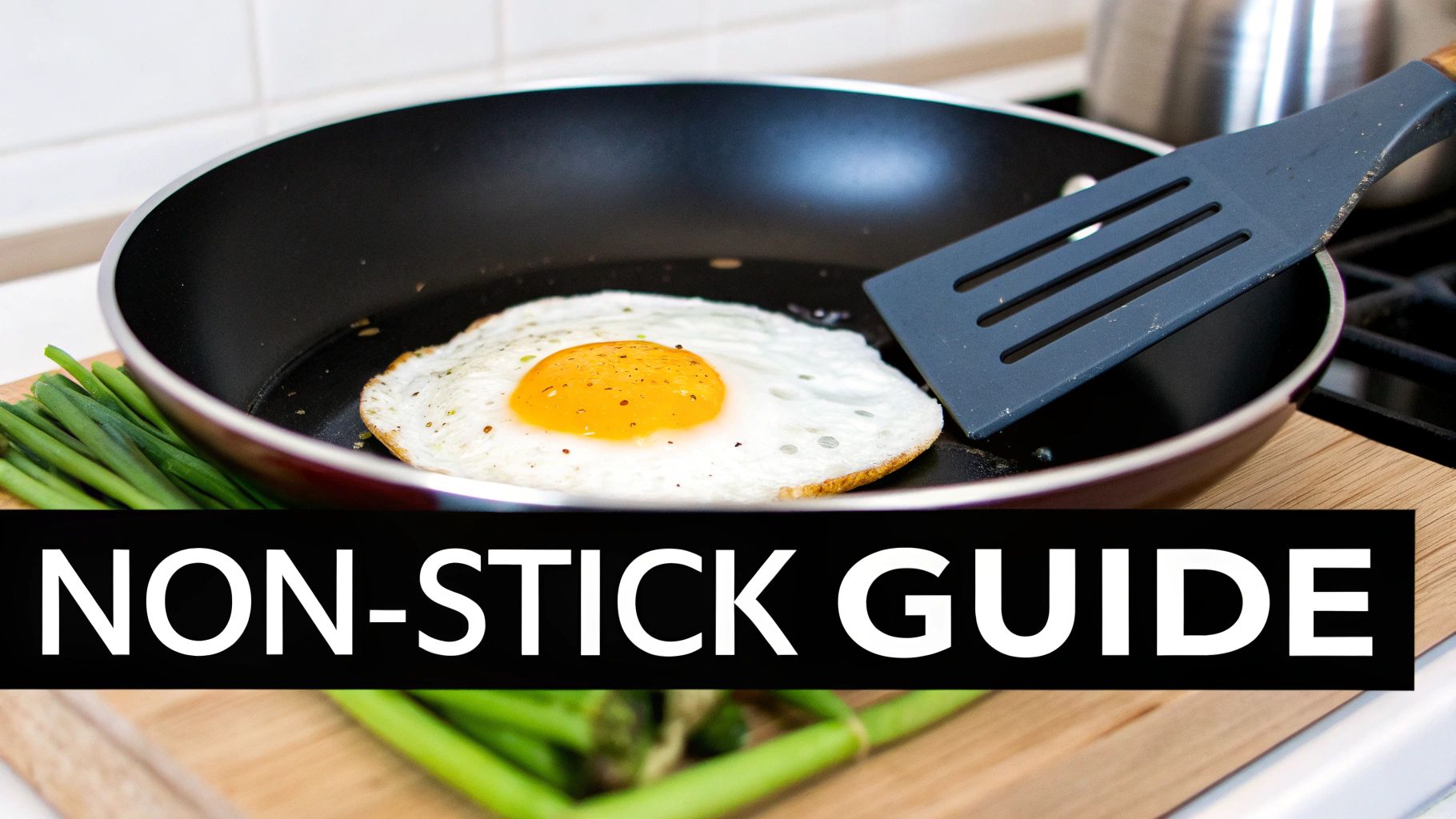 Close-up of a perfectly cooked fried egg in a non-stick frying pan with a spatula and green onions.