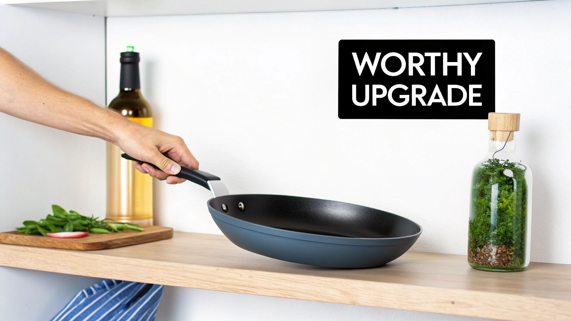 A sleek titanium frying pan sits on a modern stovetop, ready for cooking.