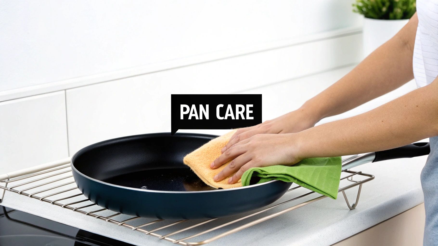 A person gently washing a titanium non stick pan in a sink