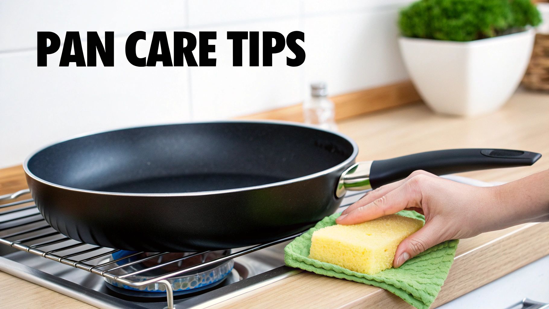 A person gently washing a titanium non stick frying pan in a sink with a soft sponge.