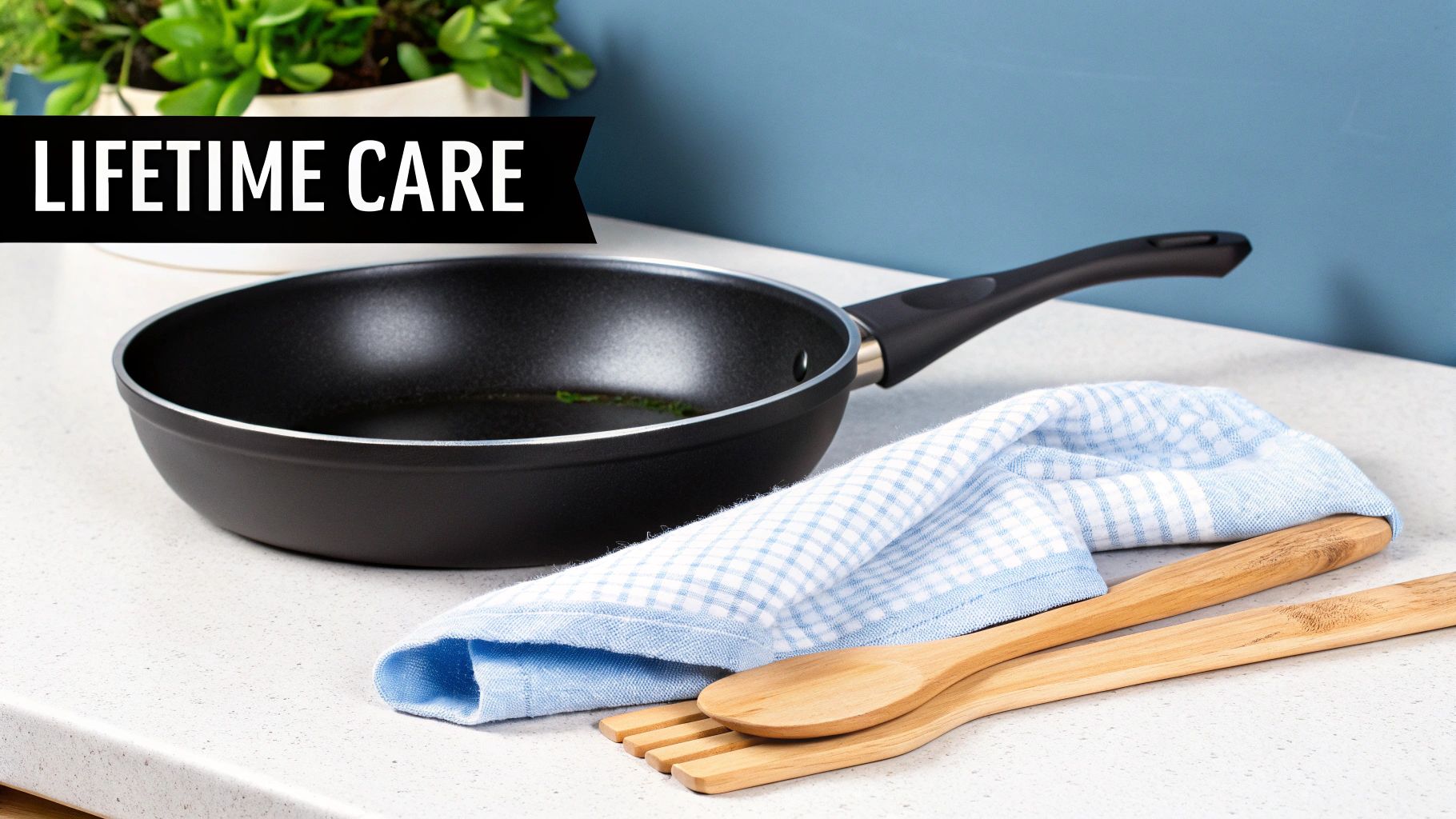 A black frying pan on a kitchen counter with wooden utensils and a blue towel, next to a plant, with a "LIFETIME CARE" banner.