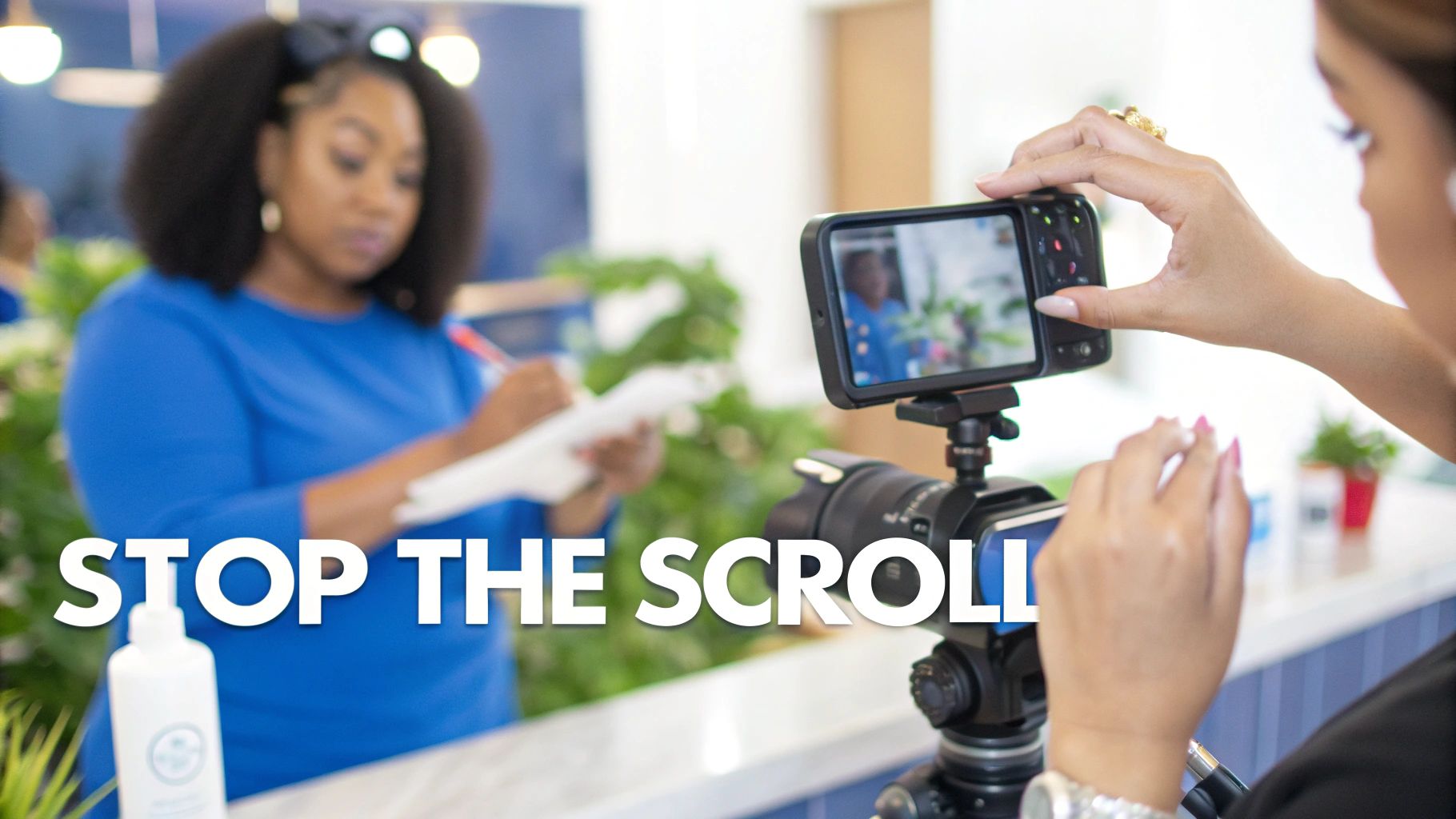 A woman records another woman writing with a smartphone on a tripod for social media content.