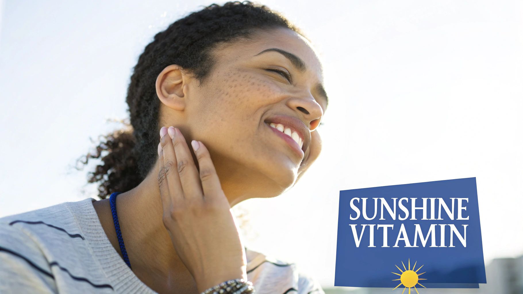 A smiling woman with freckles enjoys the sunshine, with a blue graphic saying 'SUNSHINE VITAMIN'.