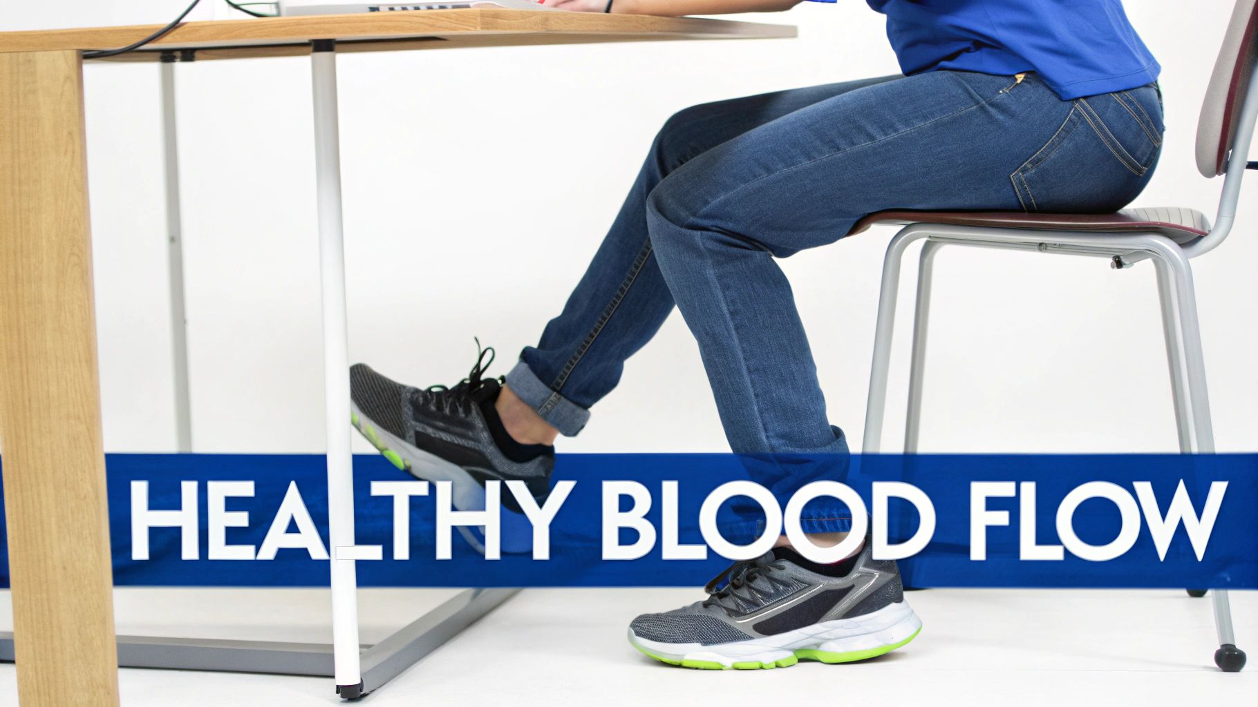 A person sitting at a desk, wearing jeans and sneakers, demonstrating leg movement for healthy blood flow.