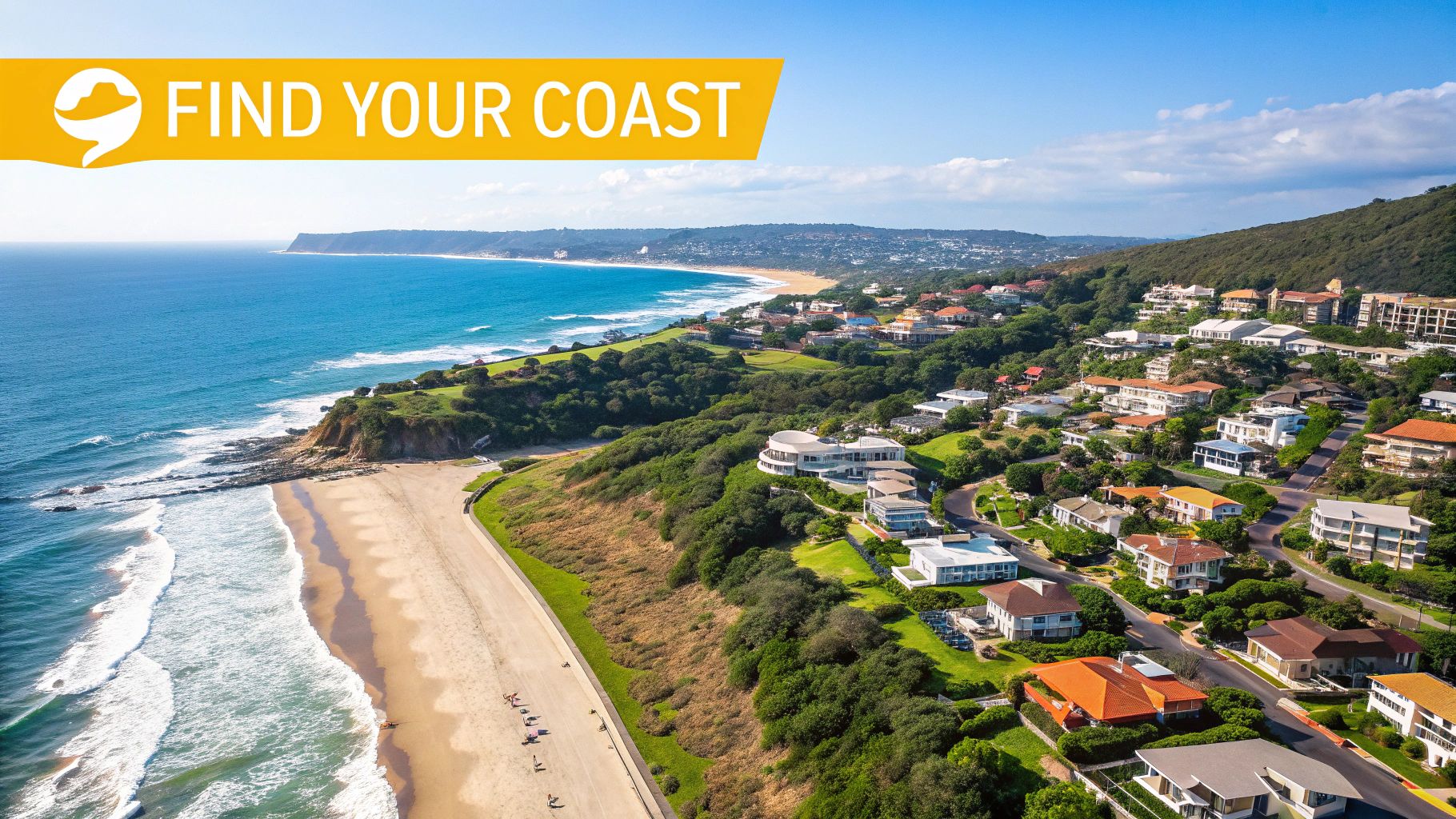 Aerial view of a beautiful coastal landscape with a long sandy beach, ocean, and hillside houses.