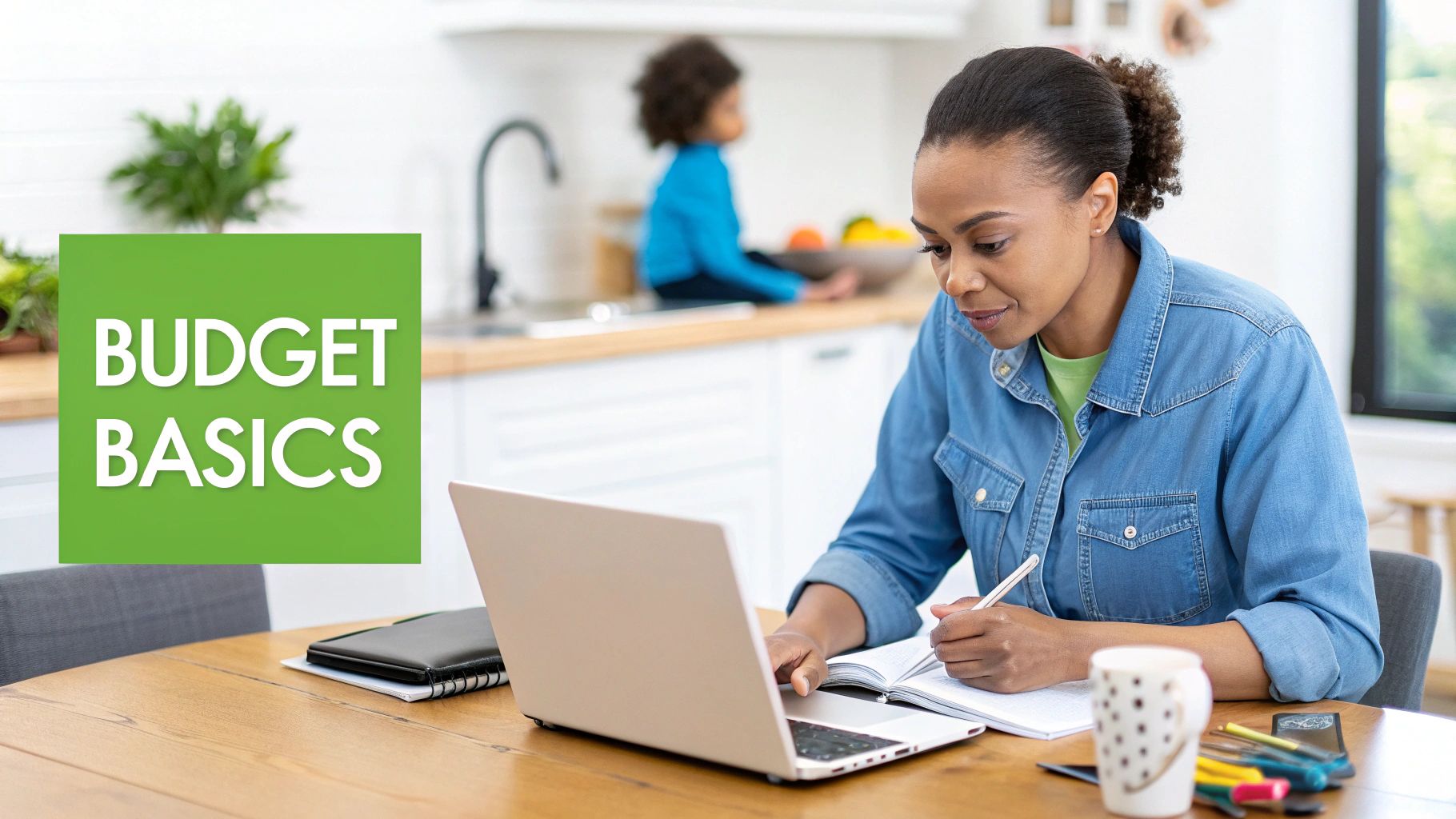 A woman reviews budget basics on her laptop and notebook at a table, with a child in the background.