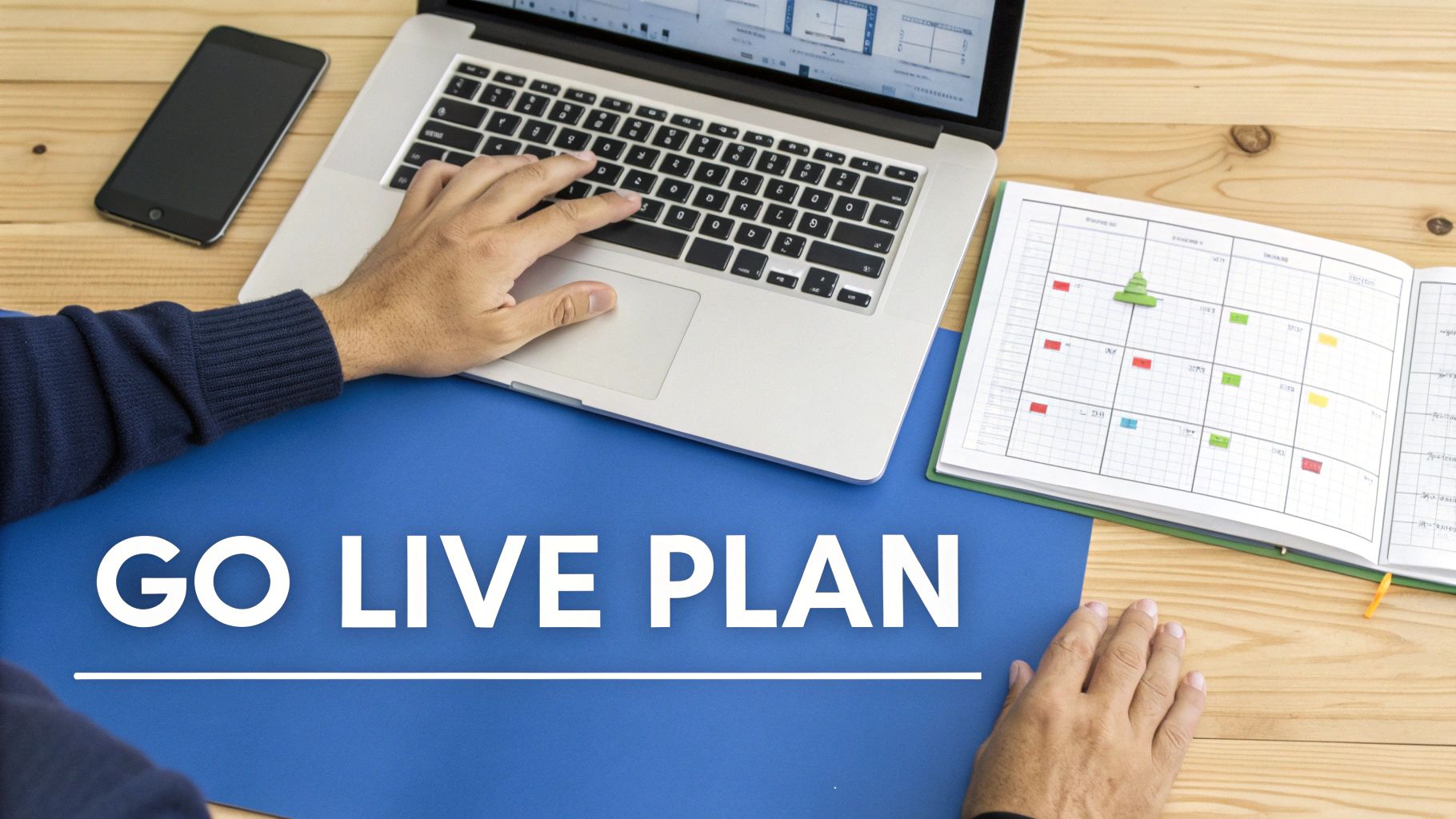 A person types on a laptop with a smartphone and open planner visible, with 'GO LIVE PLAN' text.