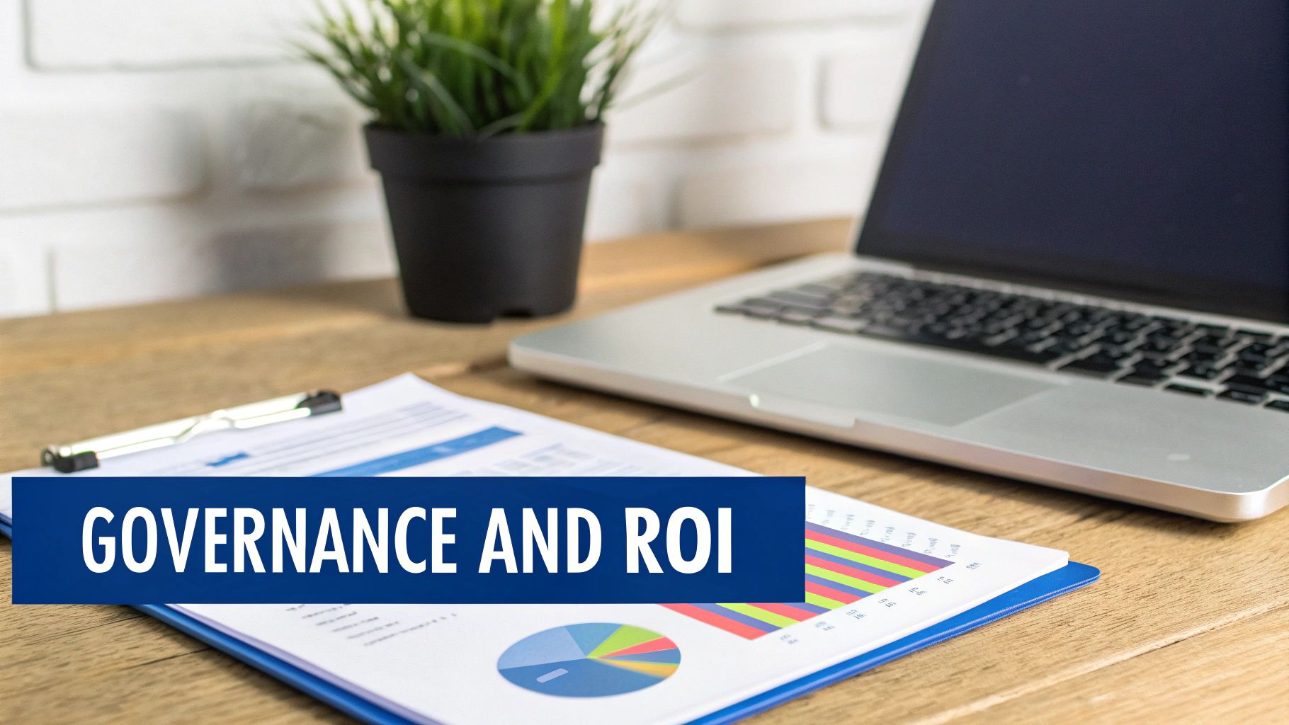 Desk with laptop, plant, and business documents showing charts, featuring 'GOVERNANCE AND ROI' banner.