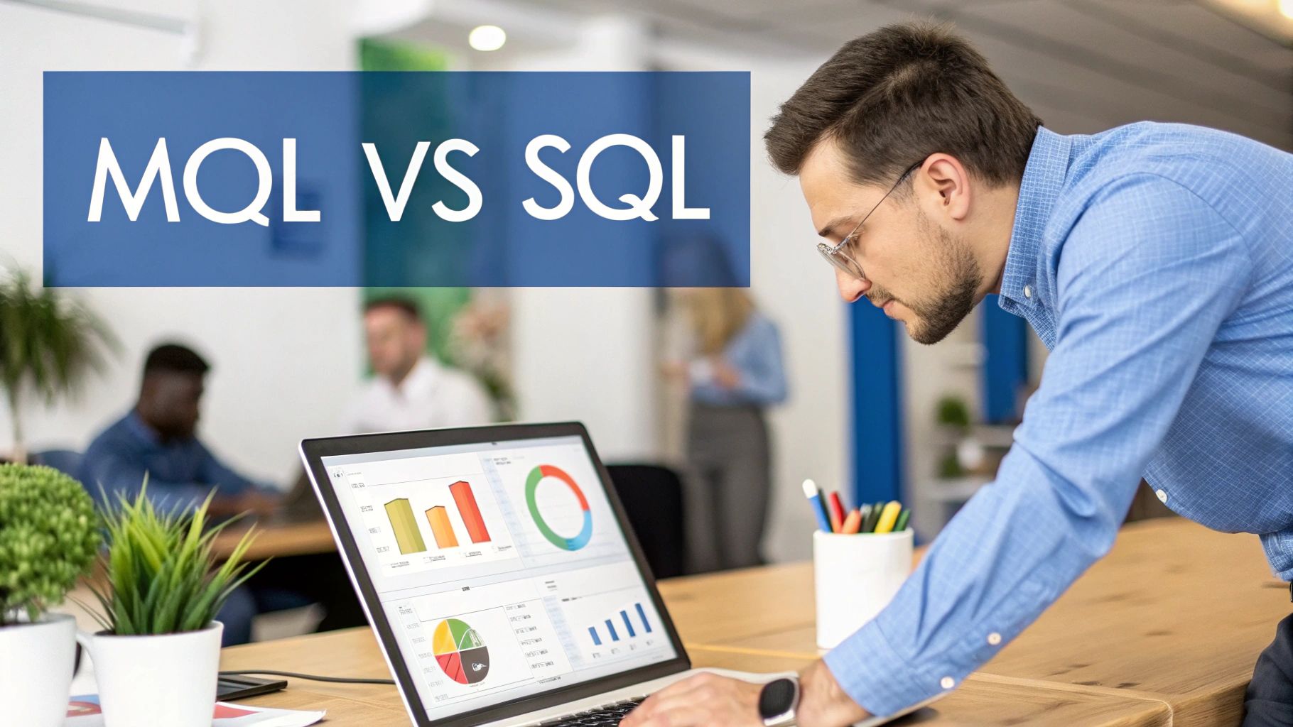 A man in an office analyzing data on a laptop, comparing MQL vs SQL concepts.