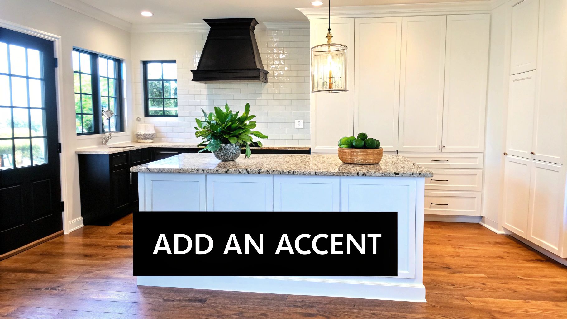 A modern kitchen with black base cabinets, white upper cabinets, a granite island, and wood floors.