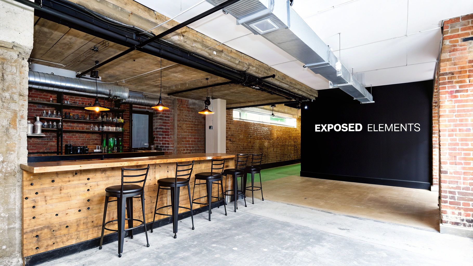 A modern industrial bar with exposed brick walls, a wooden counter, bar stools, and exposed ceiling elements.