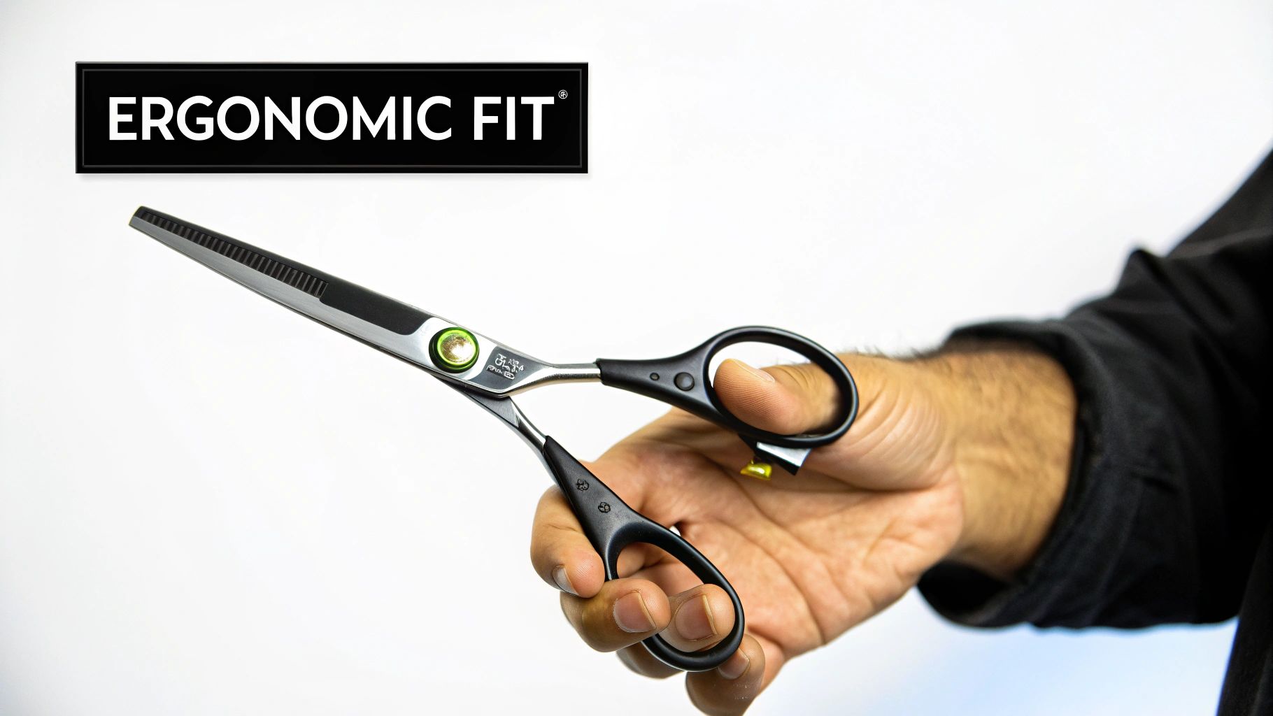 A groomer comfortably holding a pair of professional grooming shears