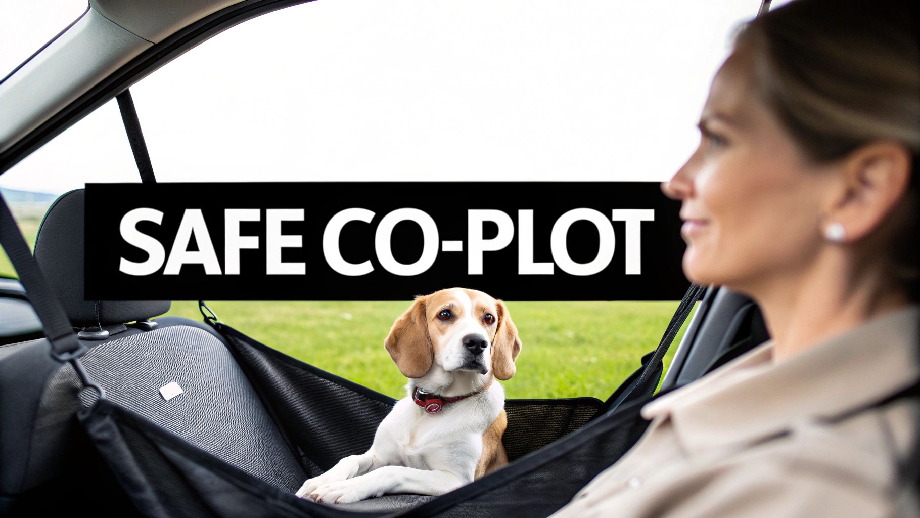 A beagle dog comfortably secured in a car hammock on the passenger seat, next to a smiling woman.