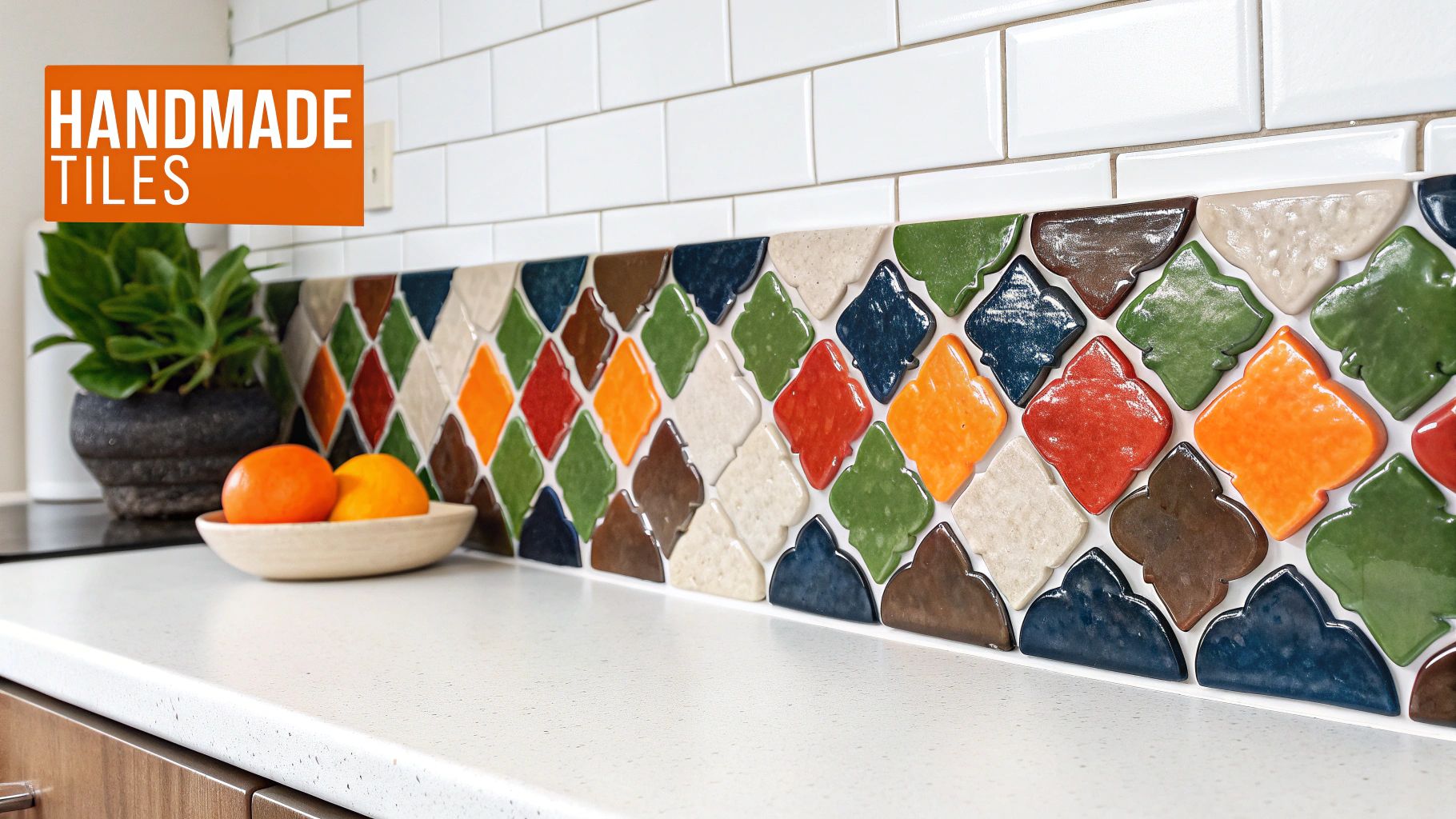 A vibrant kitchen backsplash showcasing unique handmade colorful tiles and classic white subway tiles above a clean countertop.