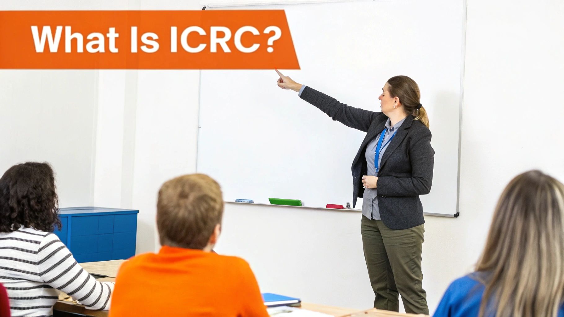 Instructor explaining "What is IICRC?" in a classroom setting, with students attentively listening, emphasizing the importance of IICRC certification in restoration services.