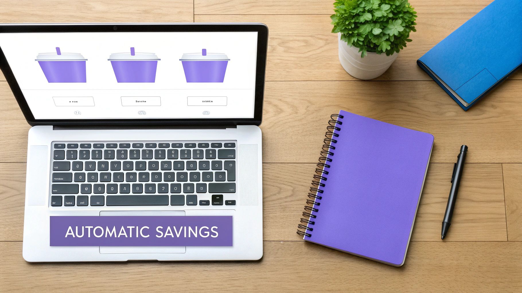 Overhead view of a laptop displaying automatic savings options, alongside office supplies on a wooden desk.