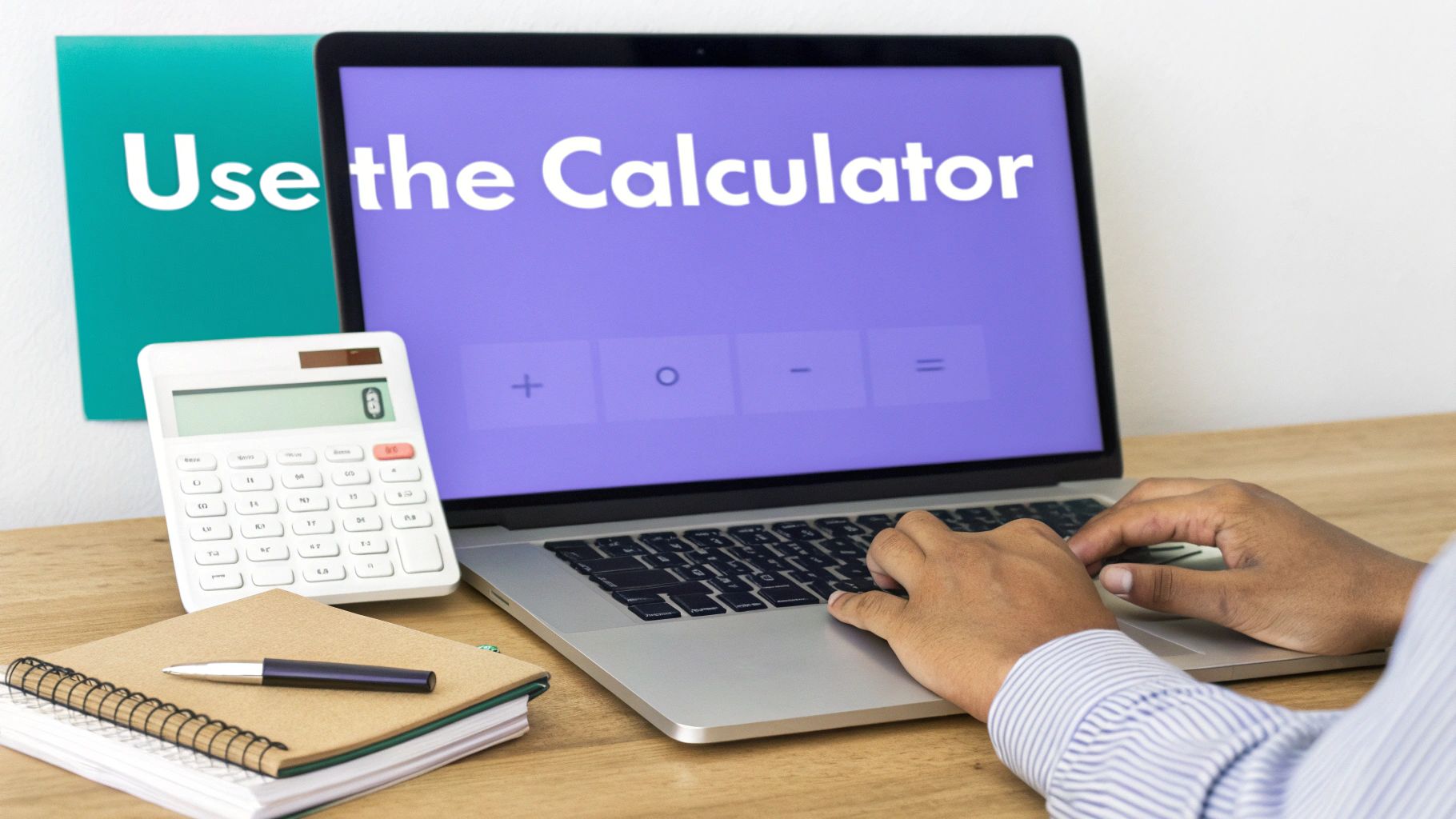 A person uses a laptop displaying a calculator application, next to a physical calculator and a notebook.