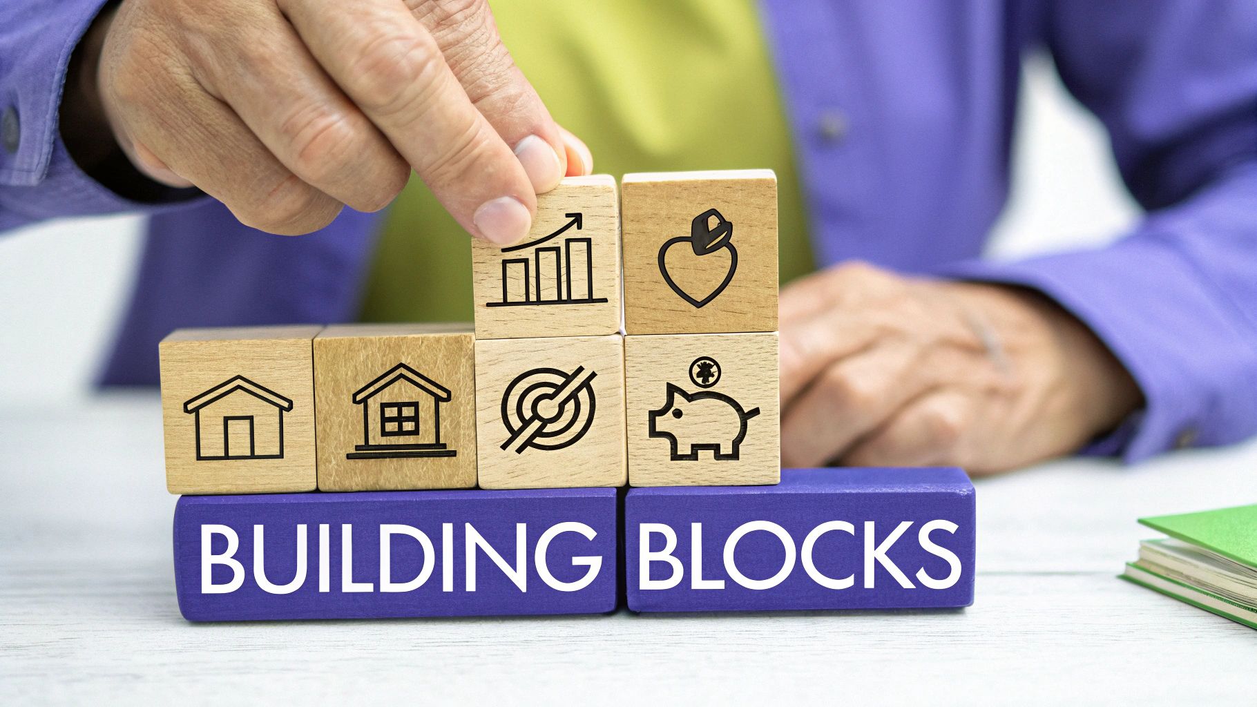 A hand places a wooden block with a growth chart icon on a stack of financial building blocks.