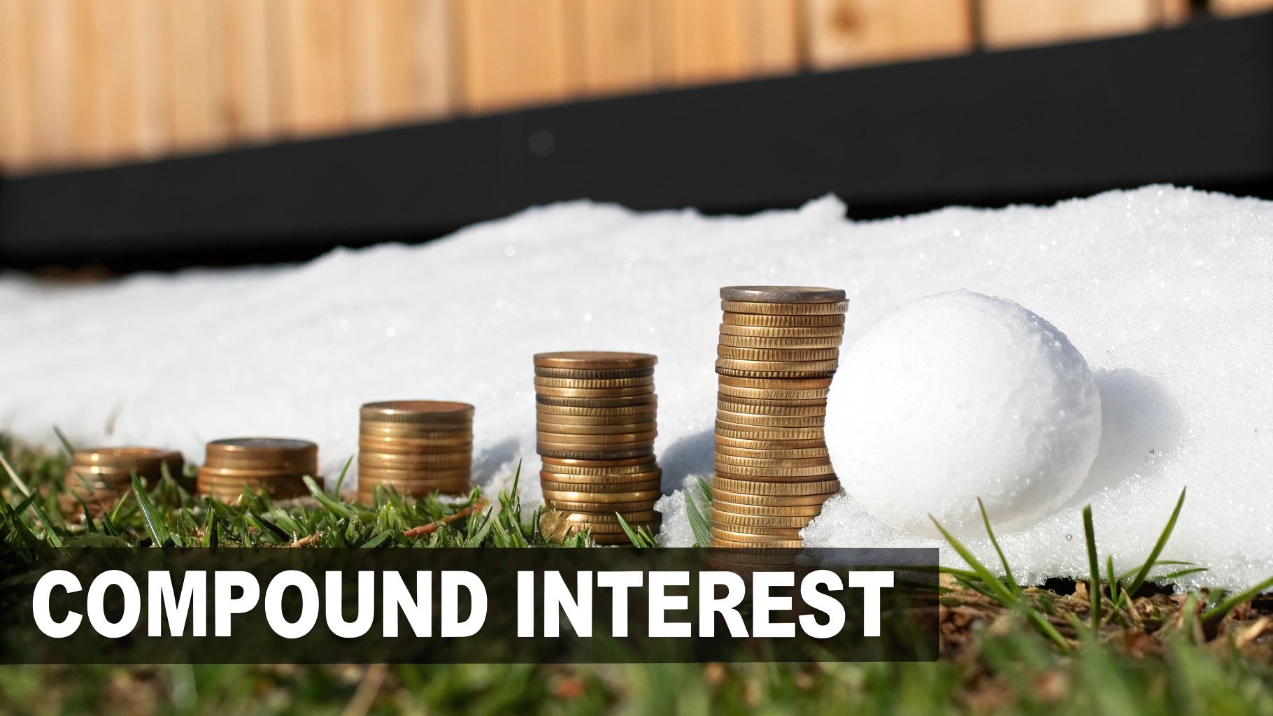 Stacks of increasing coins and a snowball on grass and snow, illustrating compound interest.