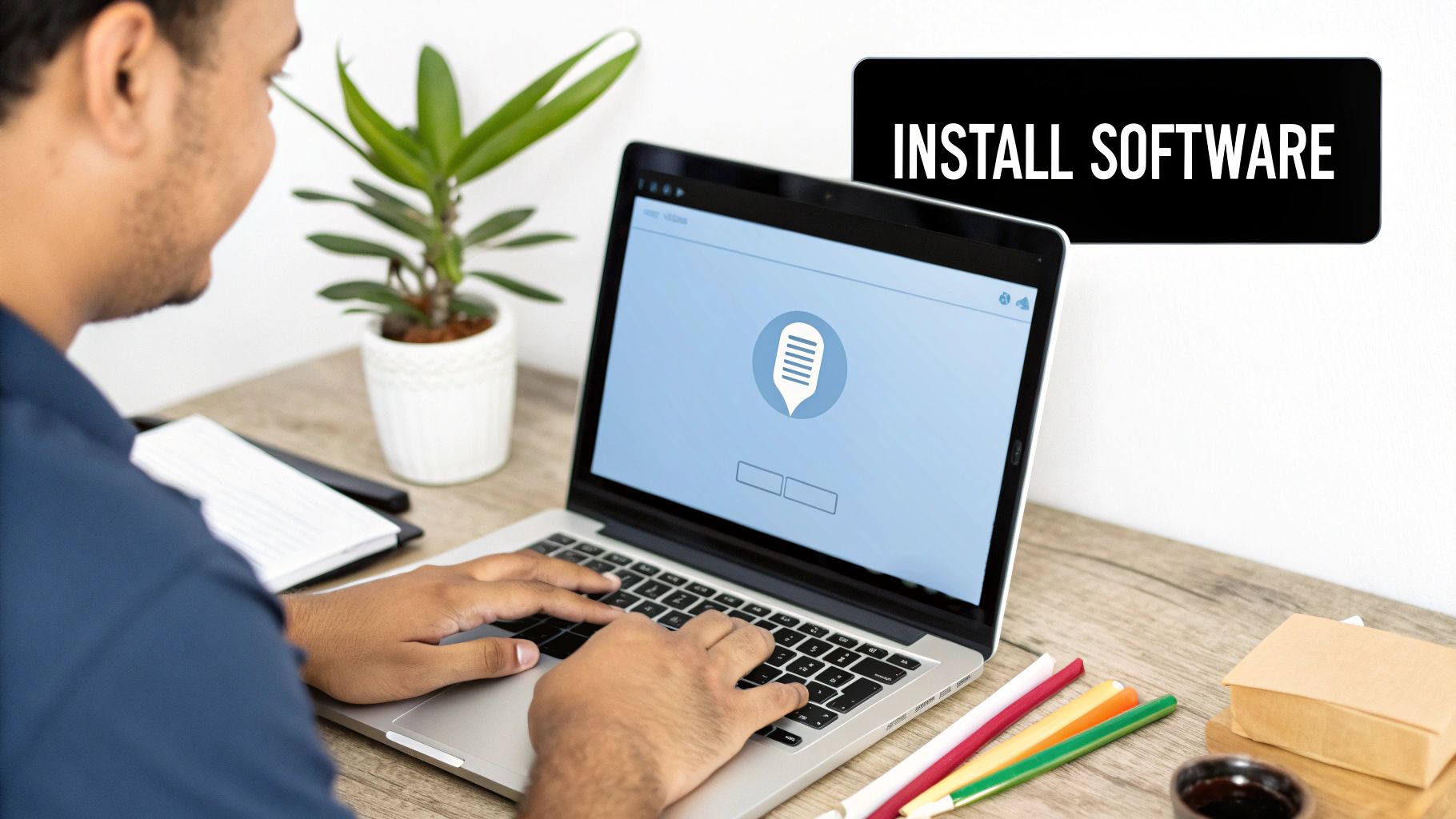 A person sitting at a desk with a laptop, headphones, and microphone, ready to make a call from their computer.