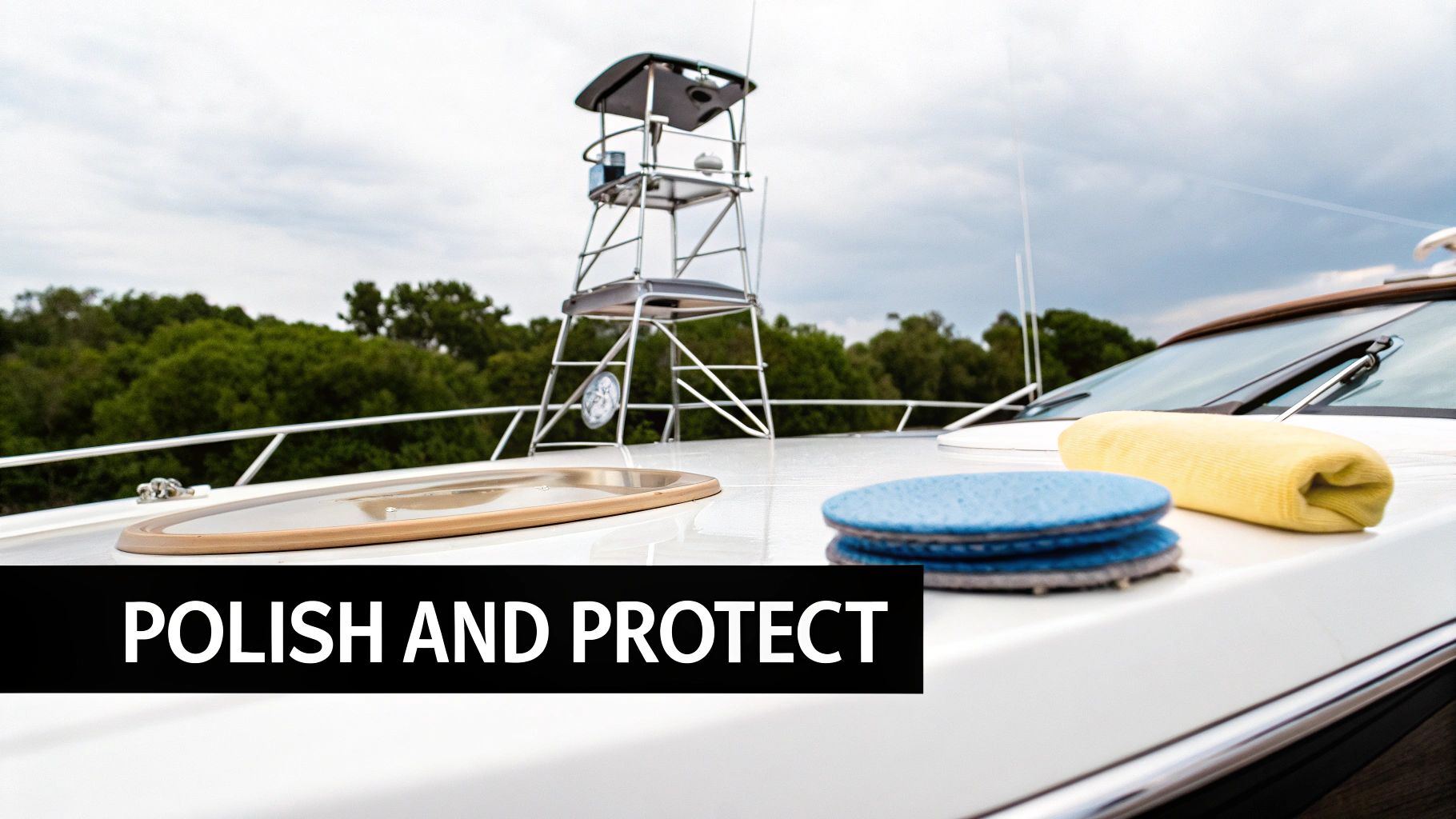 Boat deck with blue polishing pads and a yellow microfiber towel, ready for cleaning and protection.