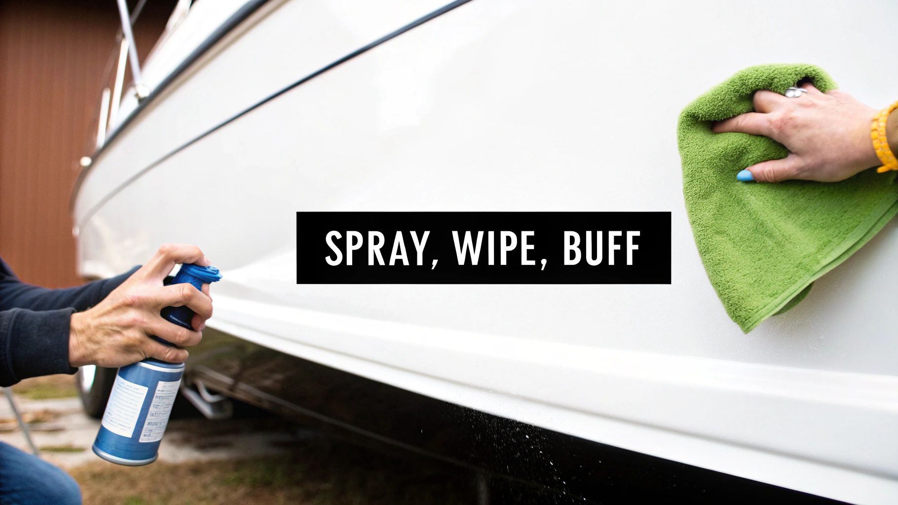 Two people cleaning a white boat: one person sprays a product, while another buffs it with a green microfiber towel.