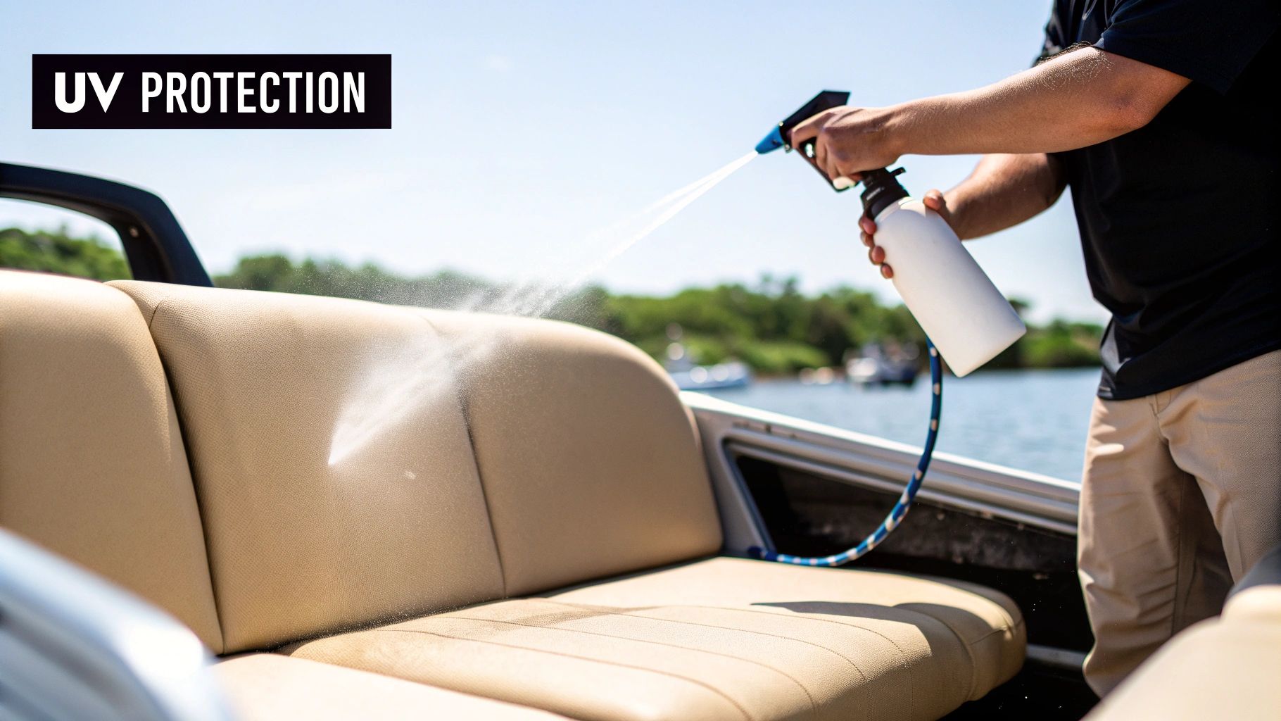 A person sprays UV protection cleaner onto beige marine boat upholstery on a sunny day.