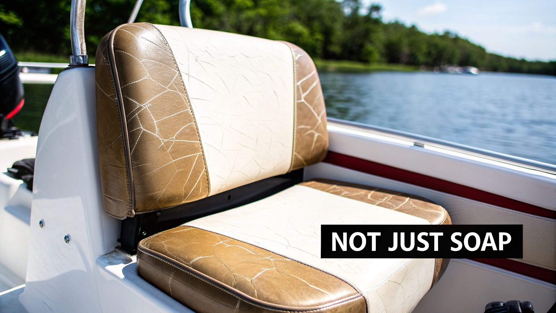 A close-up of a weathered brown and white boat seat on a boat, overlooking a lake.