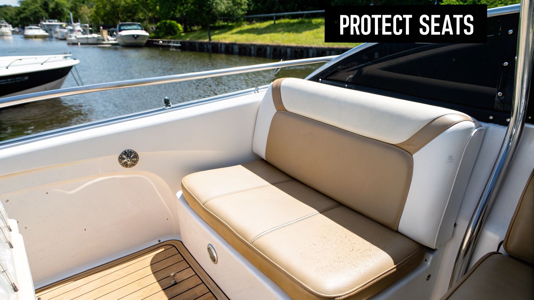 Close-up of clean tan and white boat seats with a wooden floor and other boats in the background.