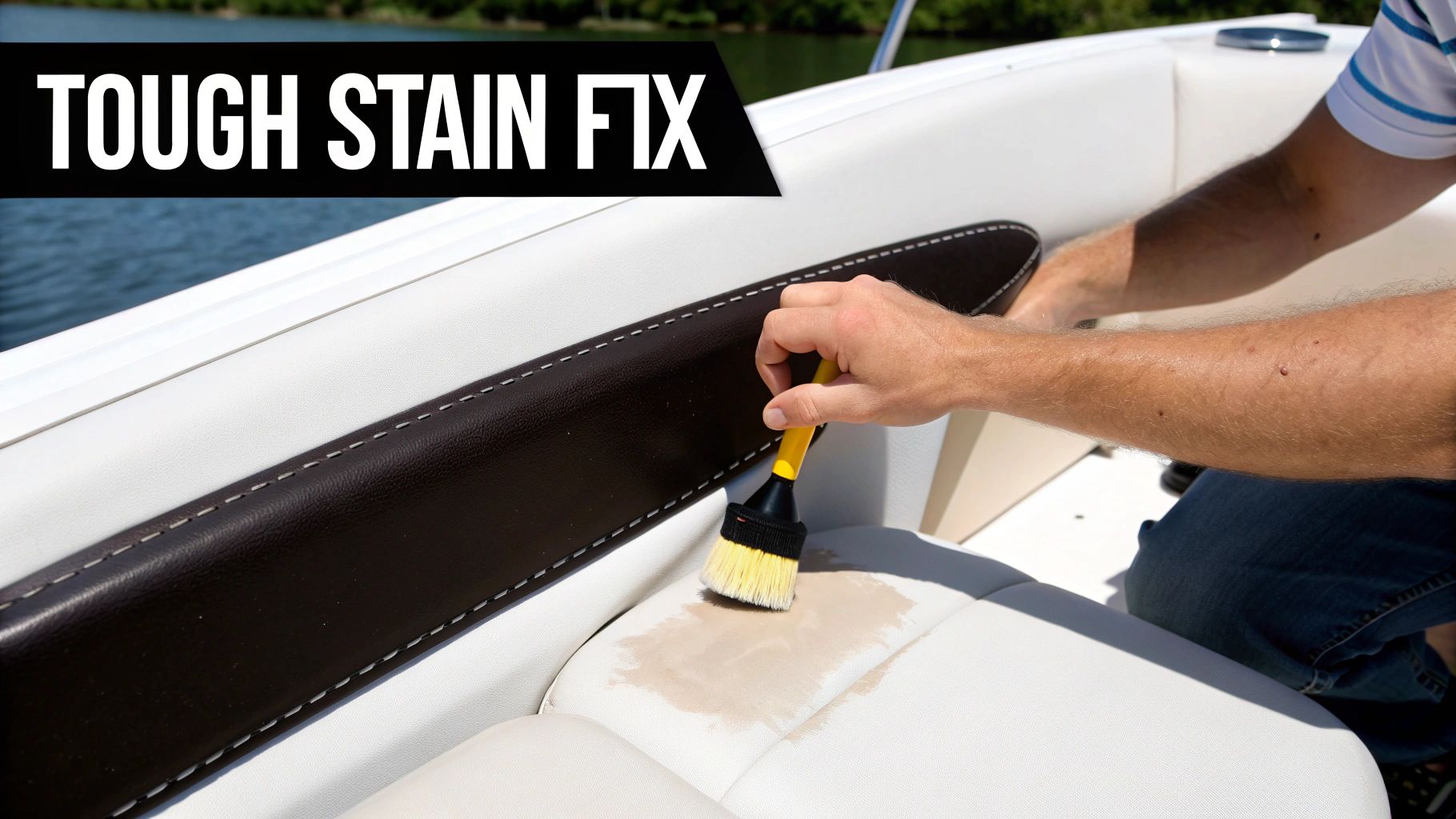 A person uses a yellow brush to clean a tough stain on white vinyl boat seats.