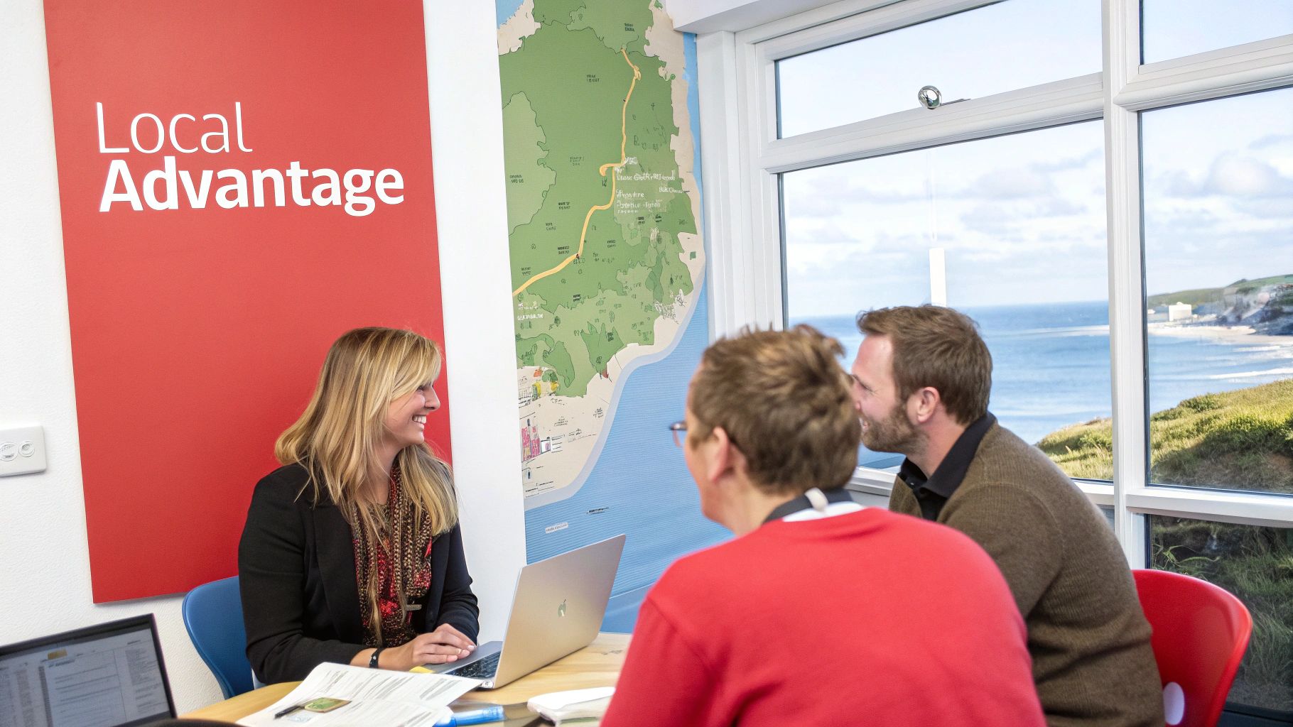 People in a meeting with a coastal view. 