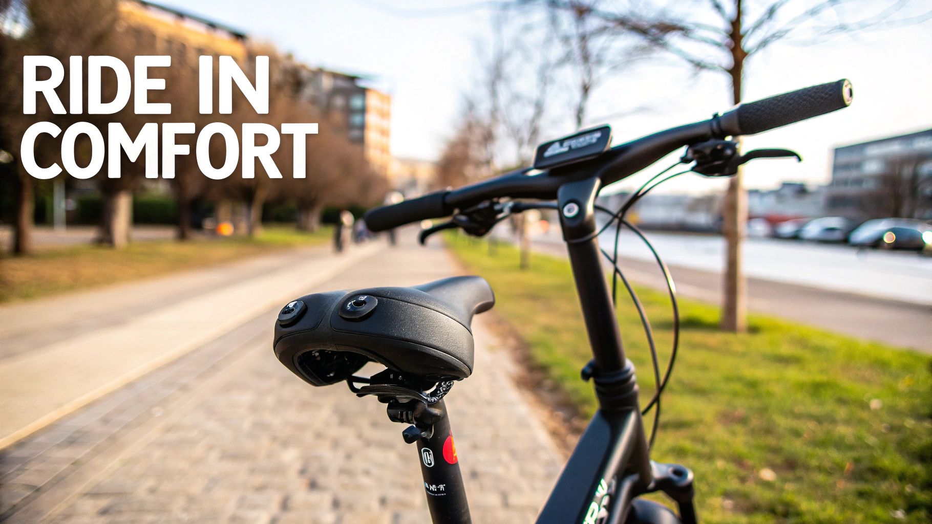 A close-up of a black bicycle saddle and handlebars, with text 'RIDE IN COMFORT' in the foreground.