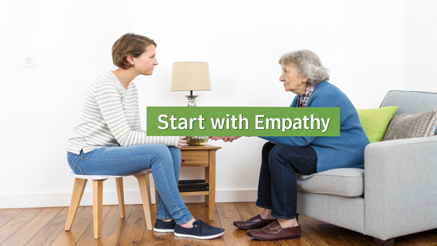 Two women, one young, one elderly, hold hands, showing care and communication with 'Start with Empathy' text.
