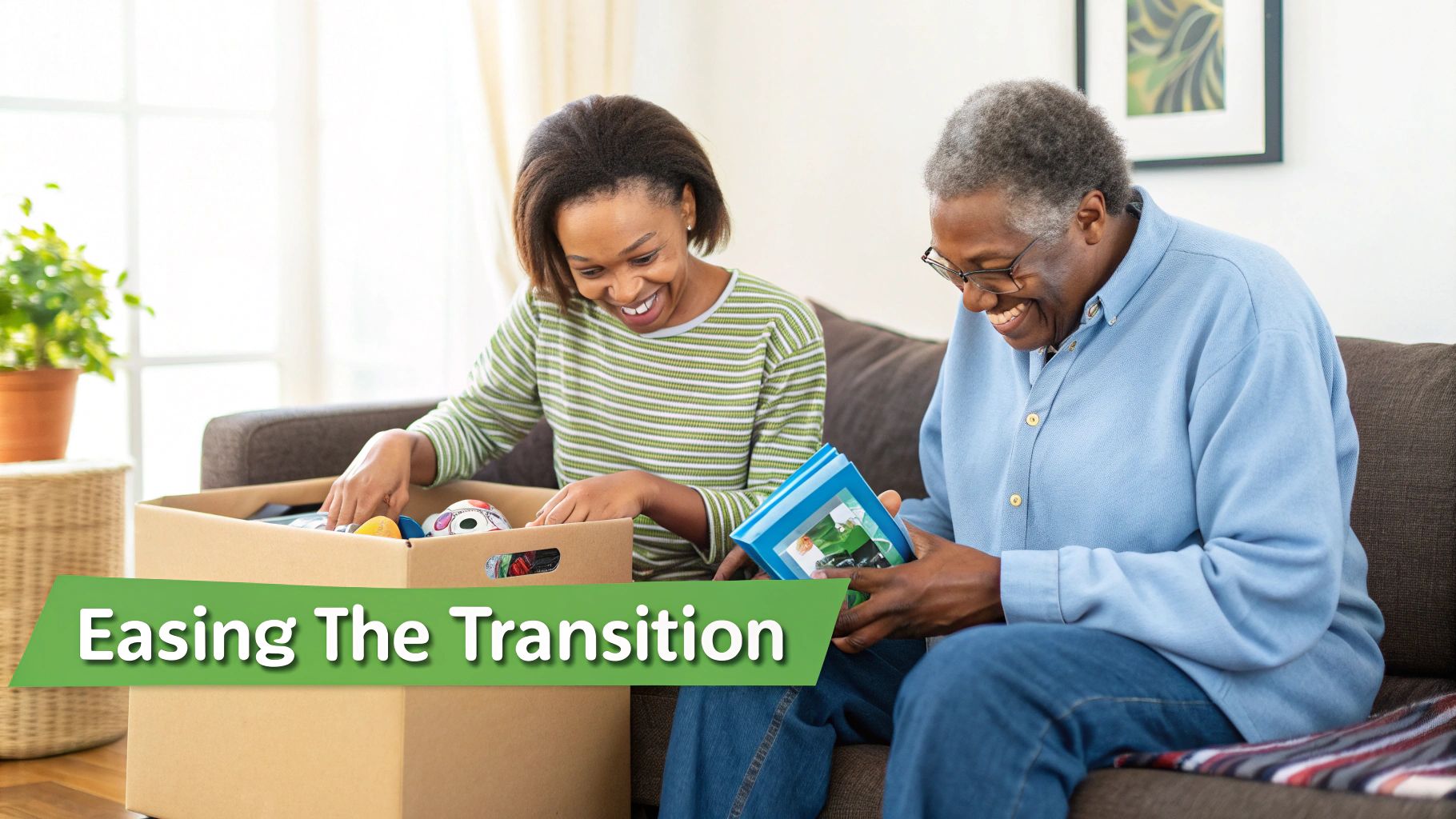 Smiling Black family members sort a moving box and look at old photos together.