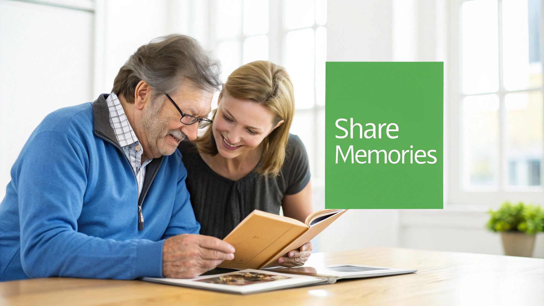 An older man and a younger woman joyfully share memories while looking through a photo album