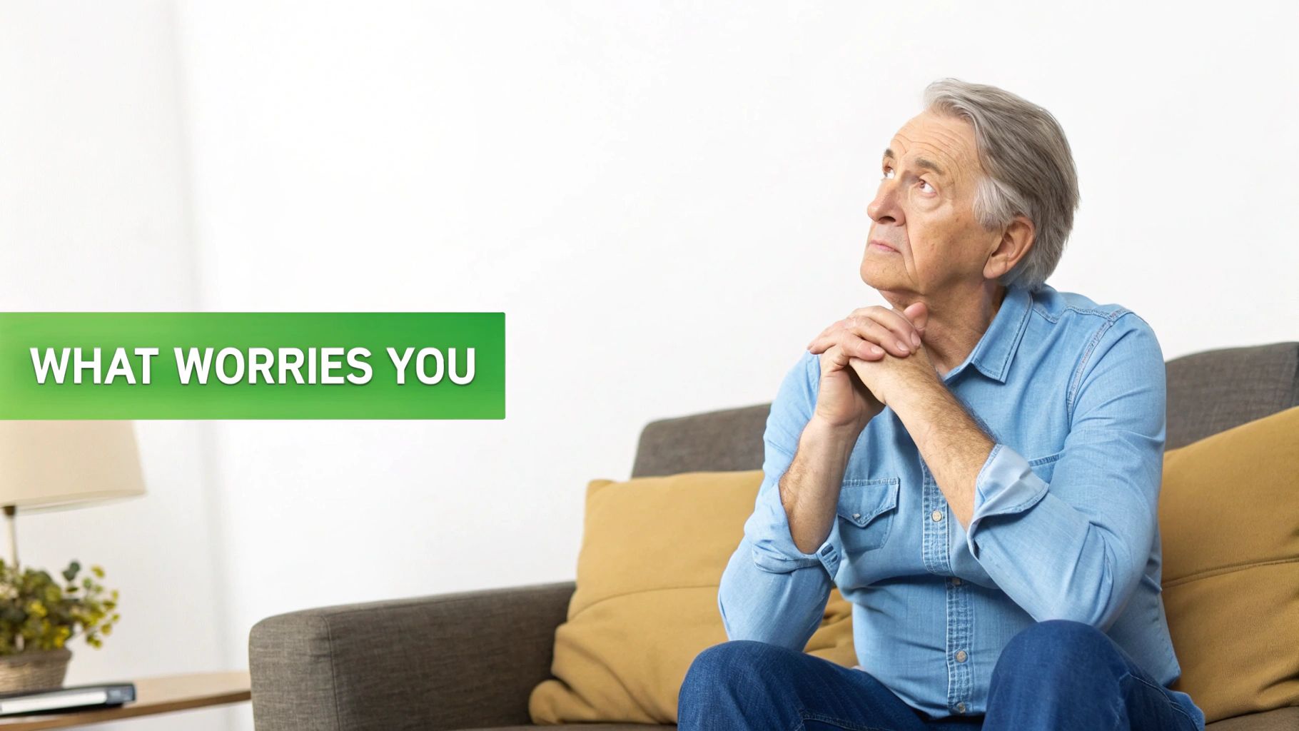 An older man on a sofa looking thoughtfully at a text asking 'WHAT WORRIES YOU'.