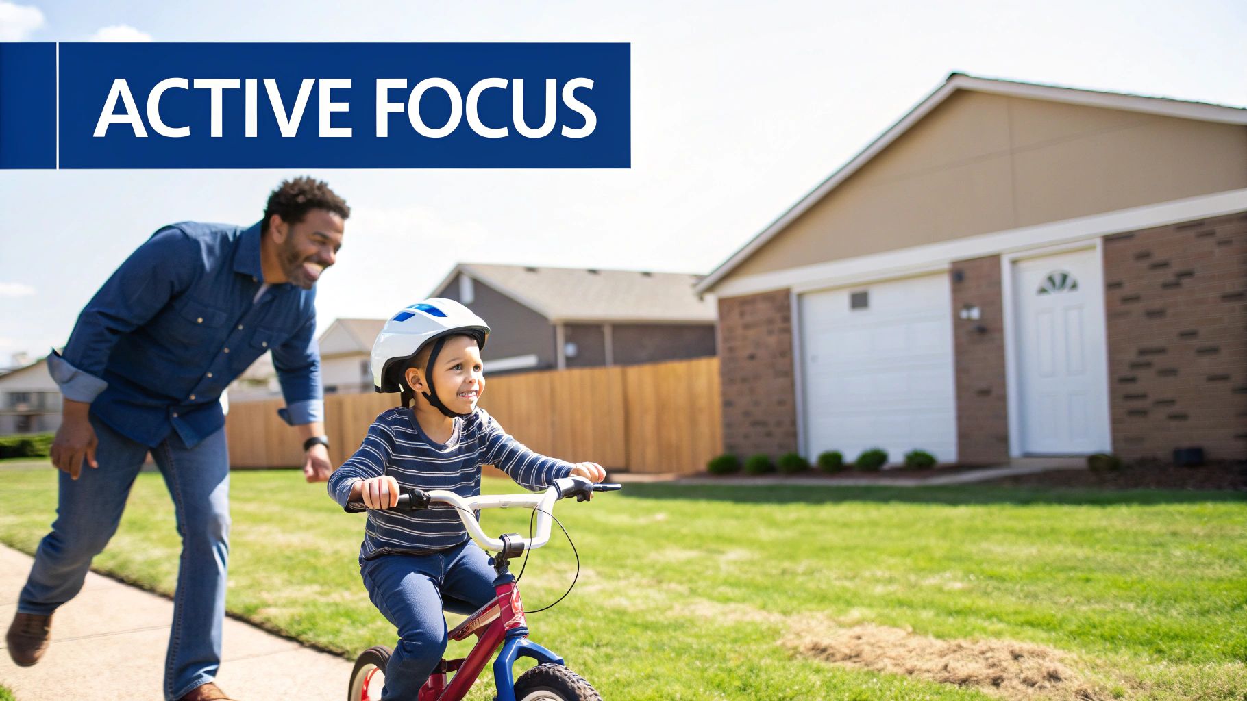 A smiling Black father teaches his young child to ride a bicycle with a helmet on a sunny day.