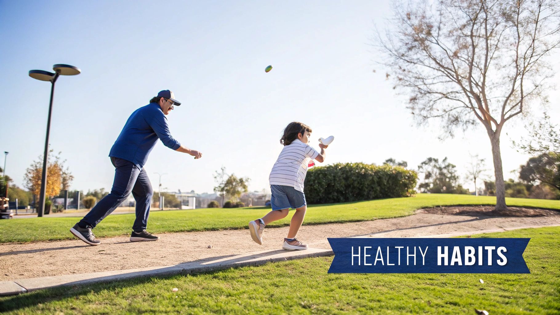 An adult and a child playing with a ball in a sunny park, promoting healthy habits.