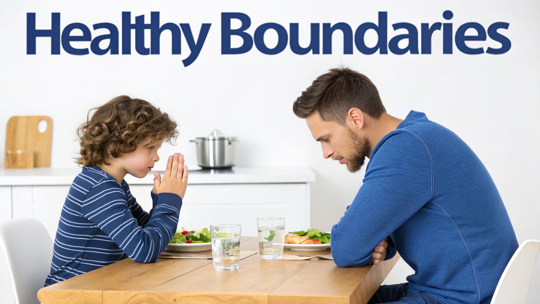 Father and son with bowed heads, hands clasped, at a dining table, possibly praying before a meal.