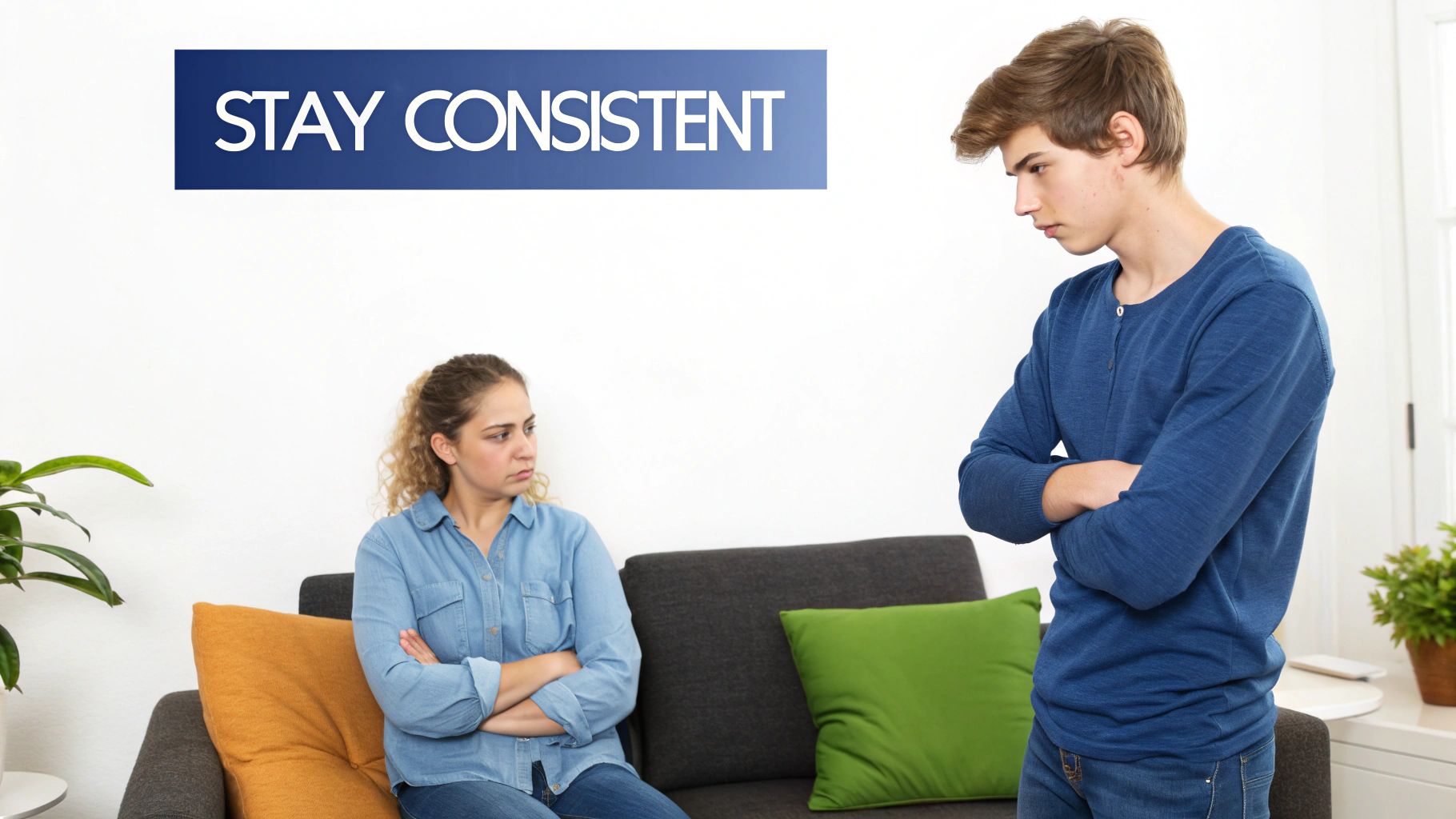 Upset young man and woman with crossed arms, looking away from each other in a disagreement.