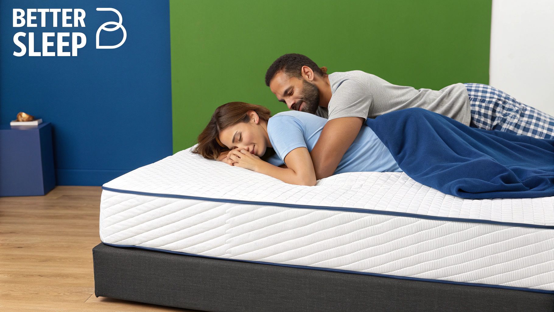 A couple embraces lovingly on a comfortable white mattress with blue piping and a quilted design.