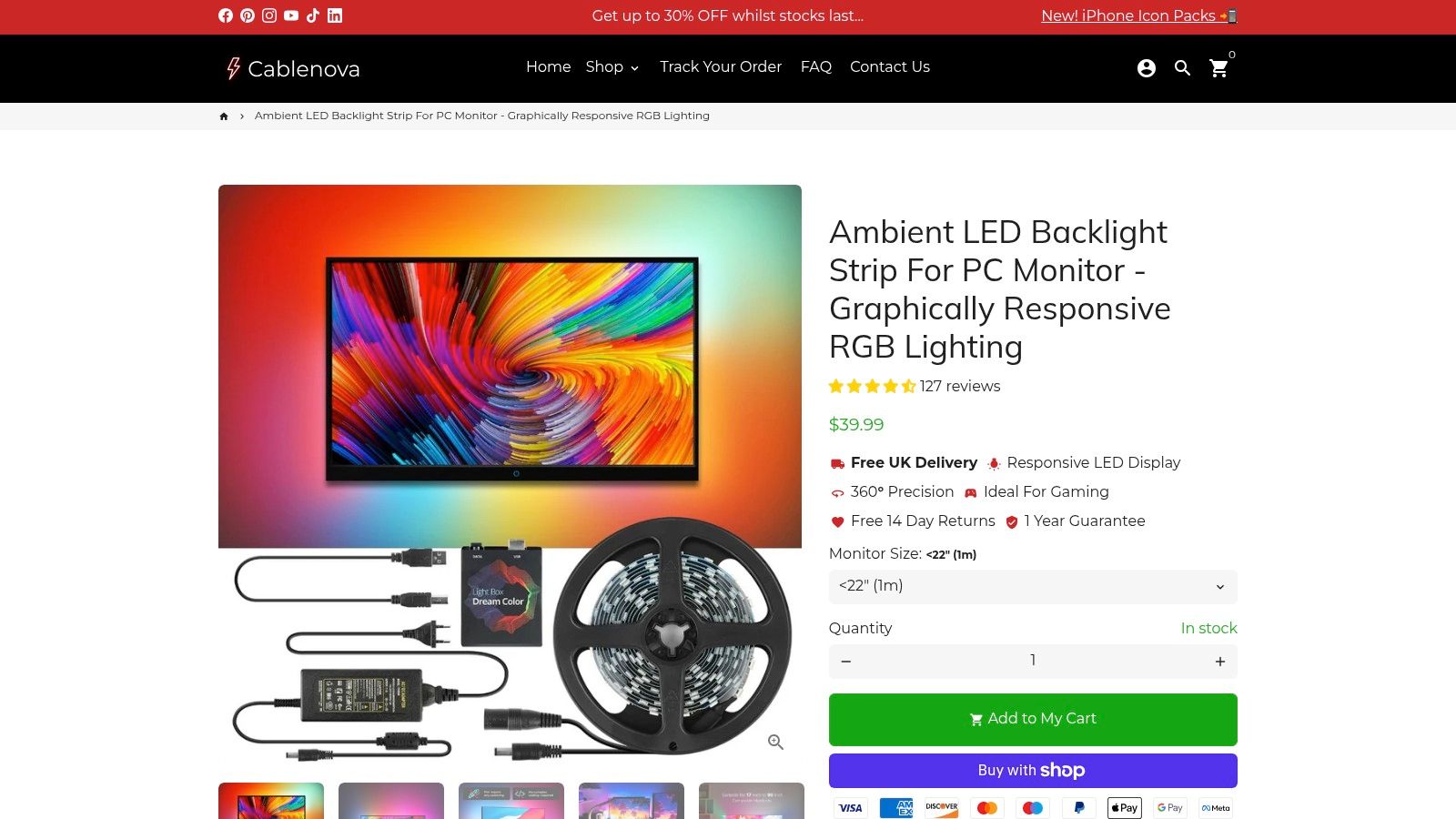 An immersive gaming setup featuring a monitor with an ambient LED backlight strip, casting colourful light onto the wall that matches the on-screen action.