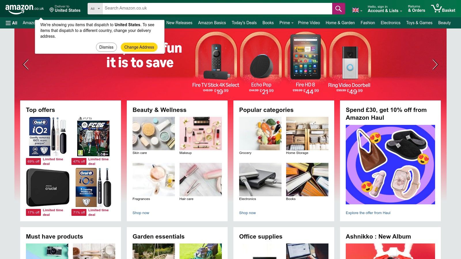 The Amazon UK homepage displaying a search bar and various product categories, representing the wide selection of car mounts available.