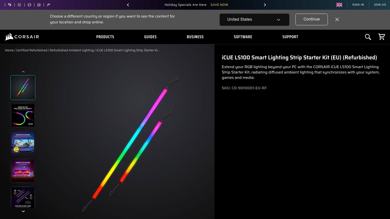 A Corsair LS100 monitor LED strip attached to the back of a gaming monitor, casting a soft, diffused blue and purple light onto the wall behind it.