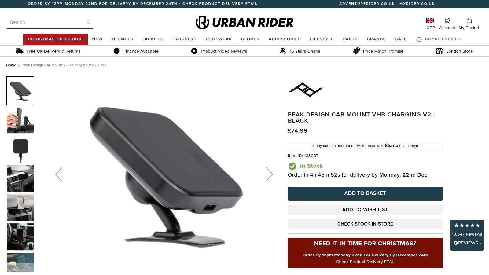 A sleek black magnetic car mount from Peak Design is shown attached to a car's air vent, holding an iPhone securely in place.